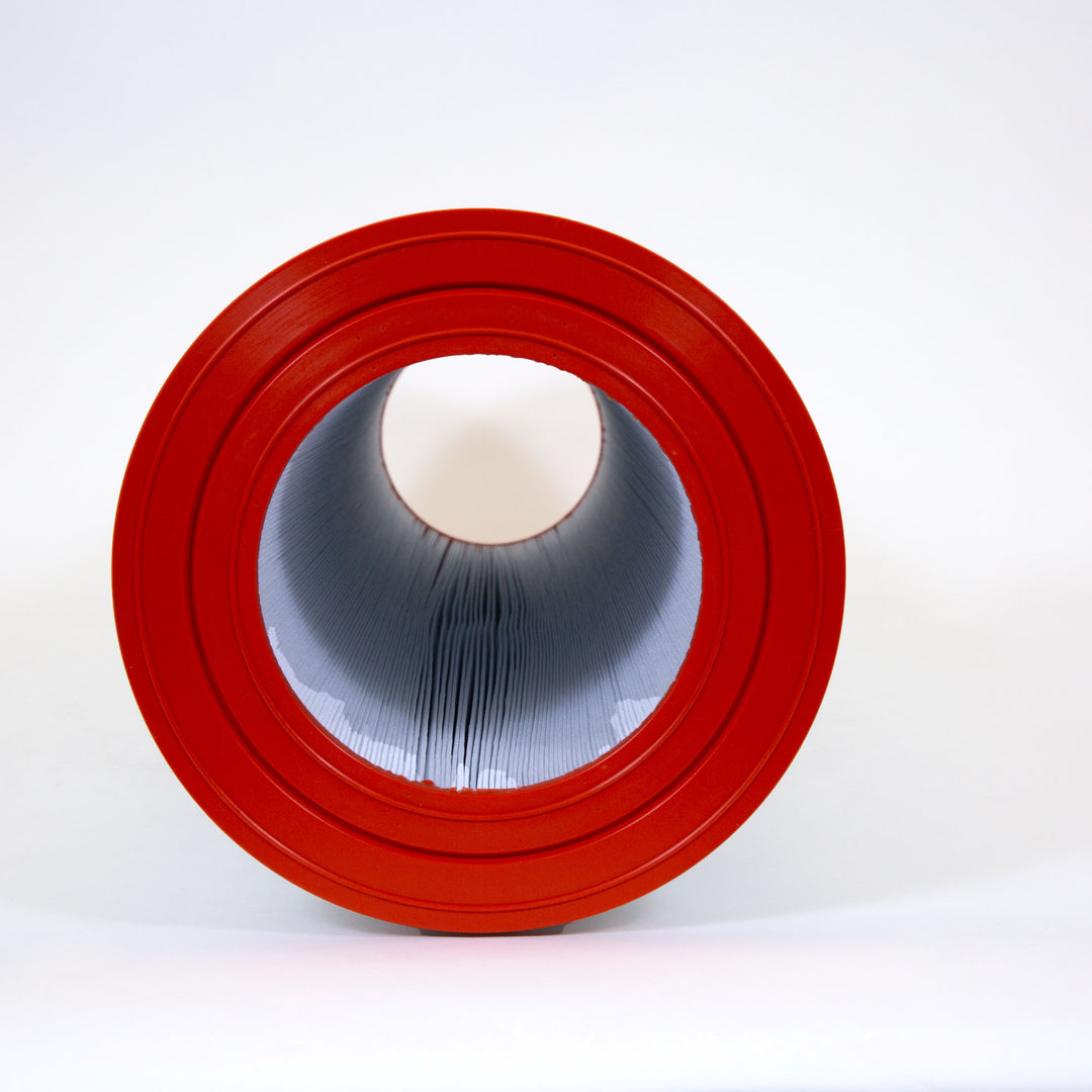 cylindrical pool filter cartridge with bright red rubber ends and tightly pleated gray filter material inside