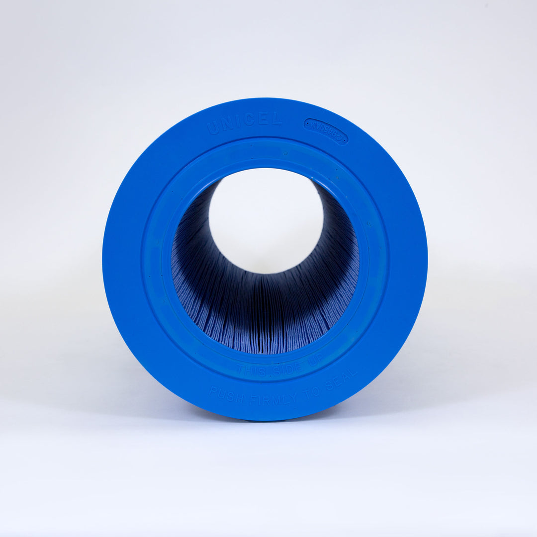 Blue cylindrical pool filter cartridge with pleated inner material and blue plastic end caps on white background
