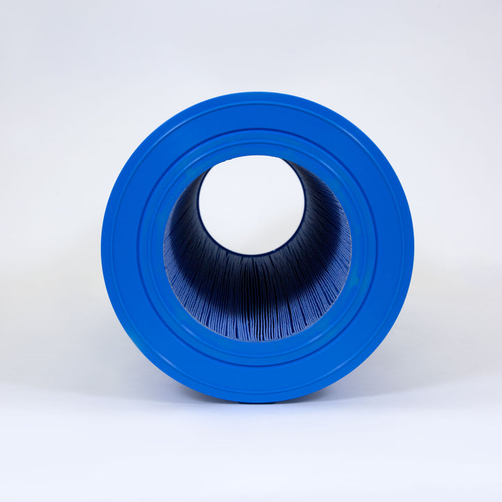 cylindrical pool filter cartridge with blue end caps and pleated filtration material inside against a white background