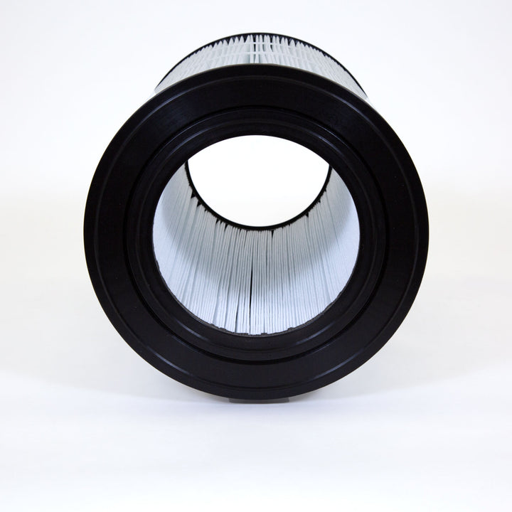 cylindrical replacement filter cartridge with white pleated material and black plastic end caps on white background