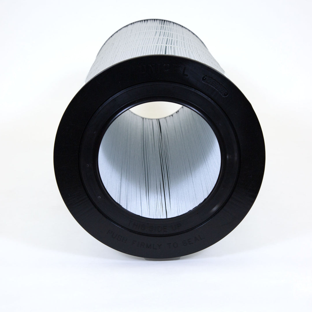 Cylindrical white pleated pool filter cartridge with black rubber end caps and hollow center shown from front
