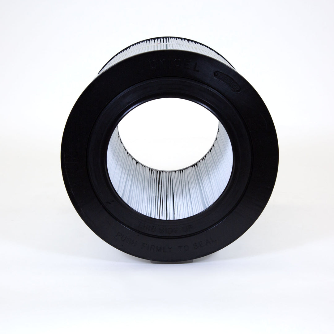 cylindrical pool or spa filter cartridge with pleated white filter material and black rubber ends photographed against white background