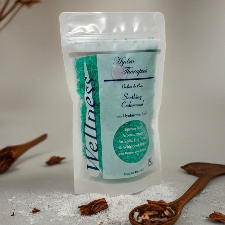 Wellness 12oz Epsom Salt Aromatherapy pouch with translucent resealable bag showing turquoise bath salts and cedarwood scent branding