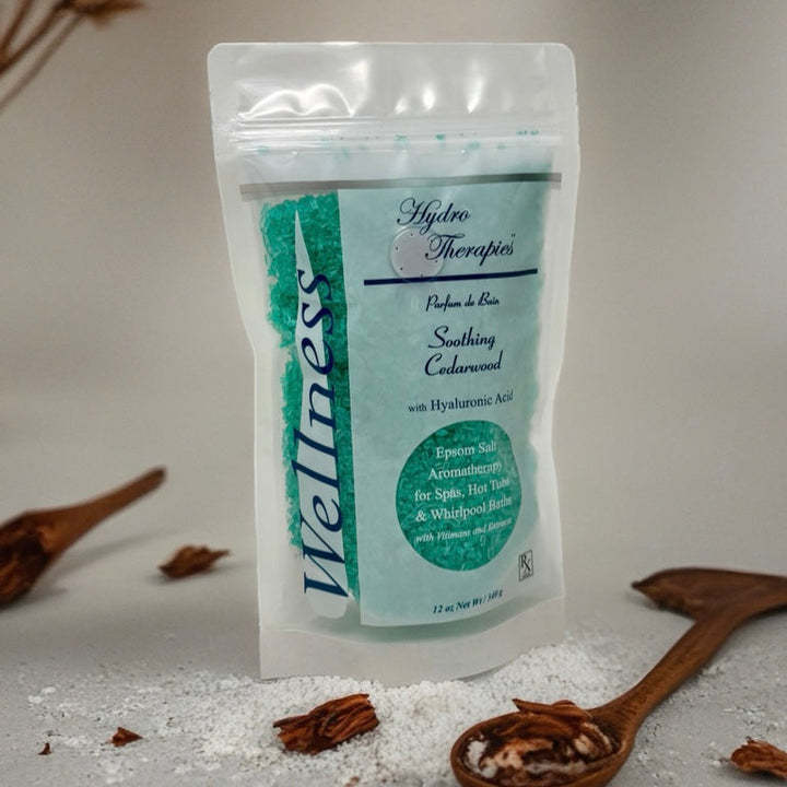 Wellness 12oz Epsom Salt Aromatherapy pouch with translucent resealable bag showing turquoise bath salts and cedarwood scent branding