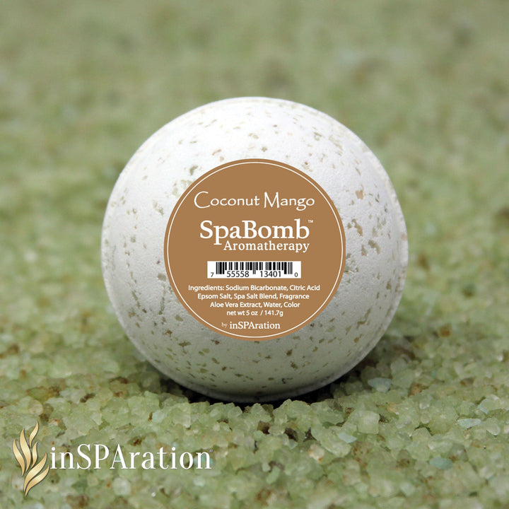 inSPAration SpaBomb Aromatherapy bath bomb in white with brown label placed on green bath salts