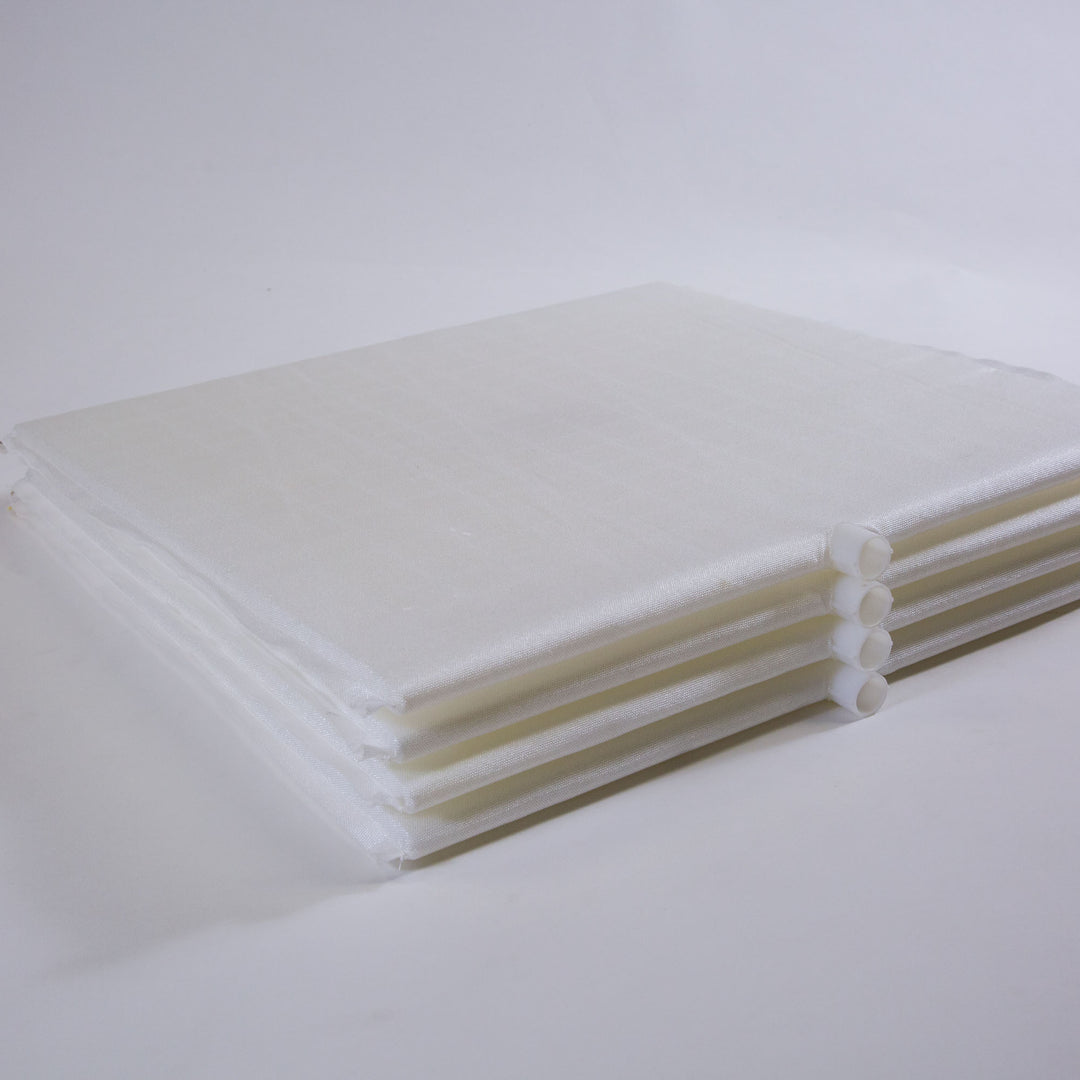 Stack of six white rectangular pool filter grids with plastic tubular connectors on a white background
