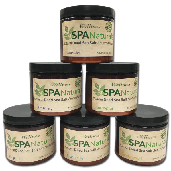 six amber jars of Spa Naturals Dead Sea Salt Crystal aromatherapy in various scents including lavender, rosemary, eucalyptus, bergamot, chamomile, and sandalwood