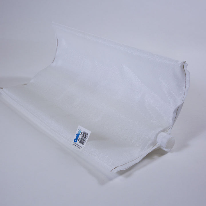 white rectangular pool filter grid with fine mesh fabric and a small plastic connector on one end laid on a white surface