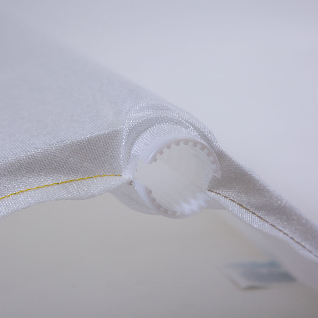 Close-up of a white mesh pool filter grid with a cylindrical plastic connector at the end and yellow stitching detail