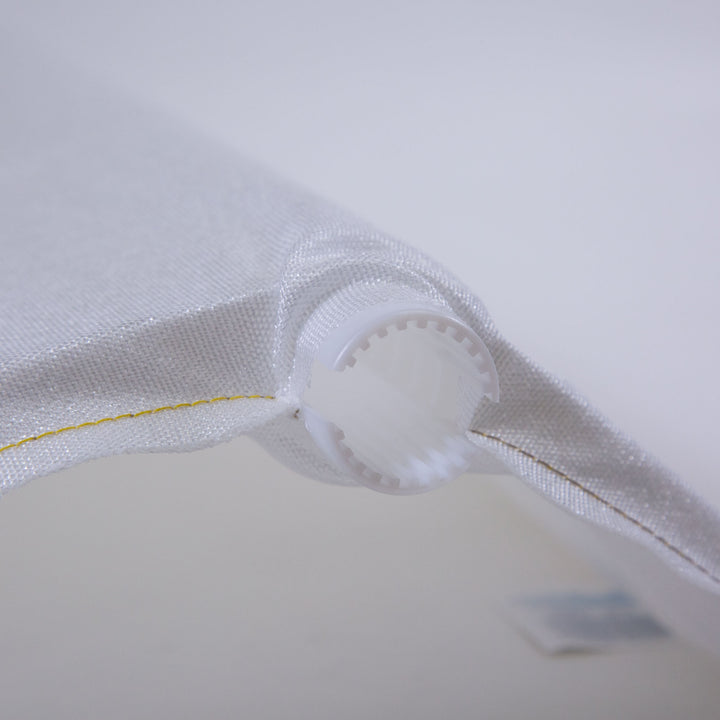 Close-up of a white mesh pool filter grid with a cylindrical plastic connector at the end and yellow stitching detail