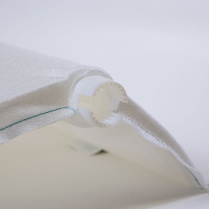 Close-up of a white mesh filter grid with a plastic circular end piece designed for pool filtration systems