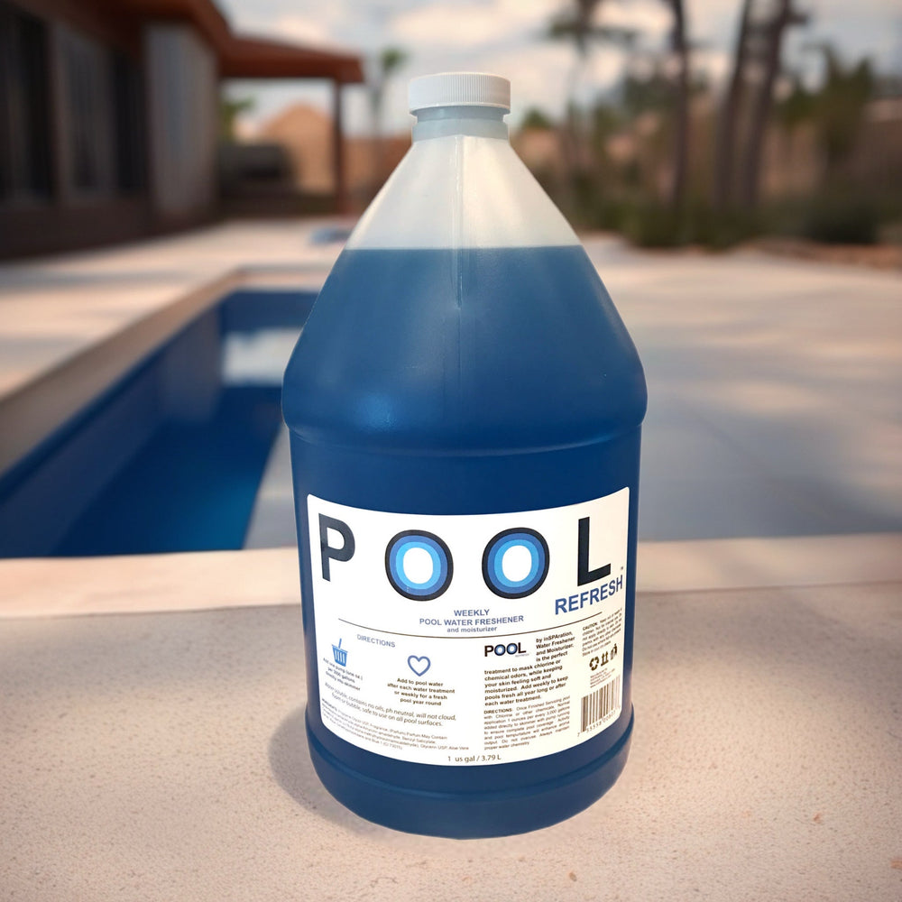 Inspration Inc Pool Refresh gallon bottle with blue liquid and white label placed on pool deck near a pool in outdoor setting
