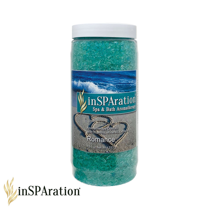 Original Aromatherapy Crystals by Insparation Inc in a clear cylindrical jar with white lid filled with turquoise blue bath crystals and a label showing ocean waves and sand hearts