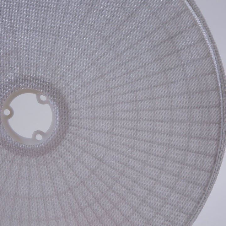 circular white filter grid disc with a center plastic ring and radially arranged textured mesh pattern