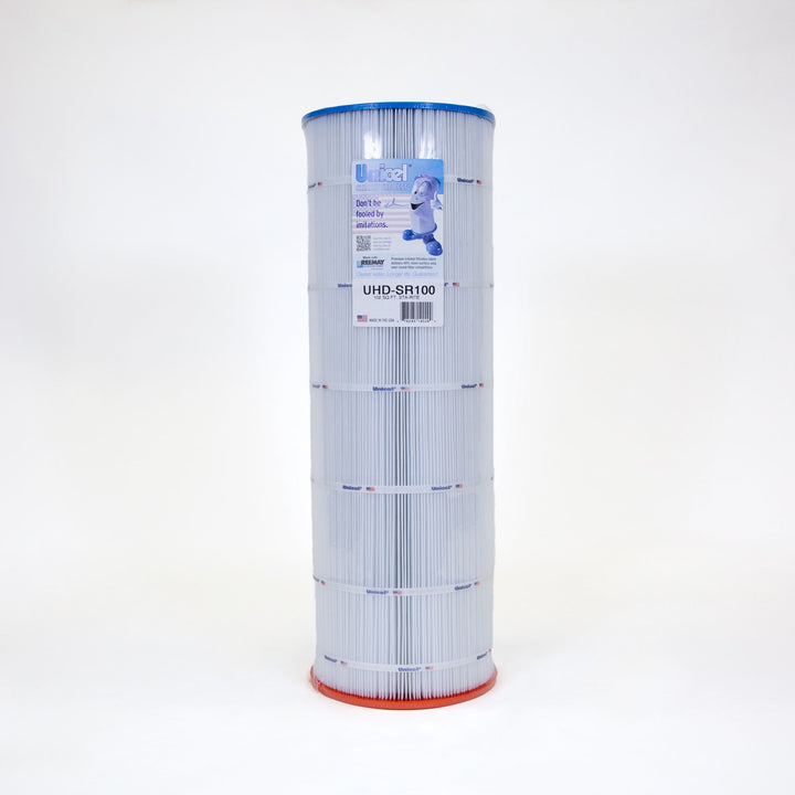 Tall cylindrical pool filter cartridge with pleated white material, blue top edge, and orange bottom edge with a label