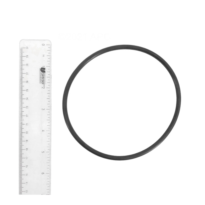 Black rubber JED 15-472 chlorinator O-ring shown beside a ruler measuring about 4.5 inches across.