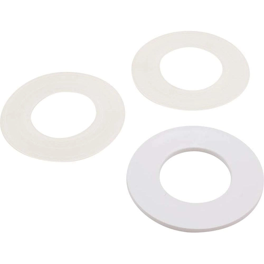 three round white plastic or rubber washer-like rings of different sizes arranged on a white background