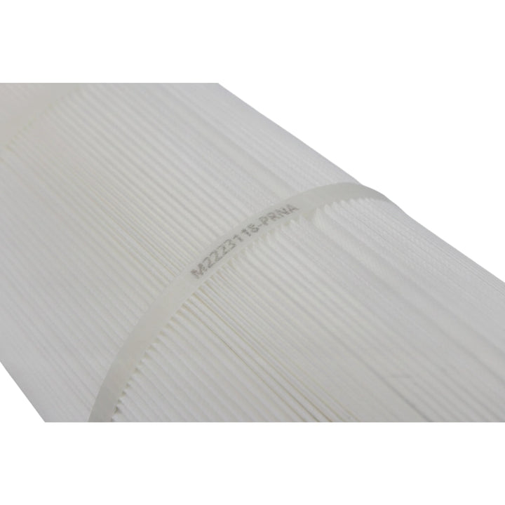 Close-up of pleated white filter media on a Pentair CNC Plus 520 pool filter cartridge, model code printed on fabric.