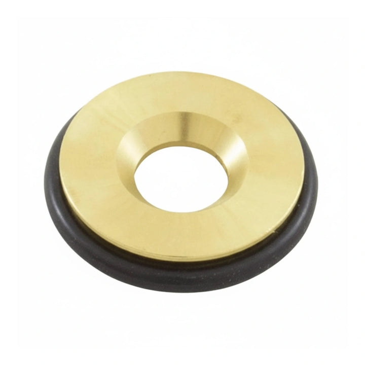 circular brass component with a central hole and a black rubber ring around its edge on a white background