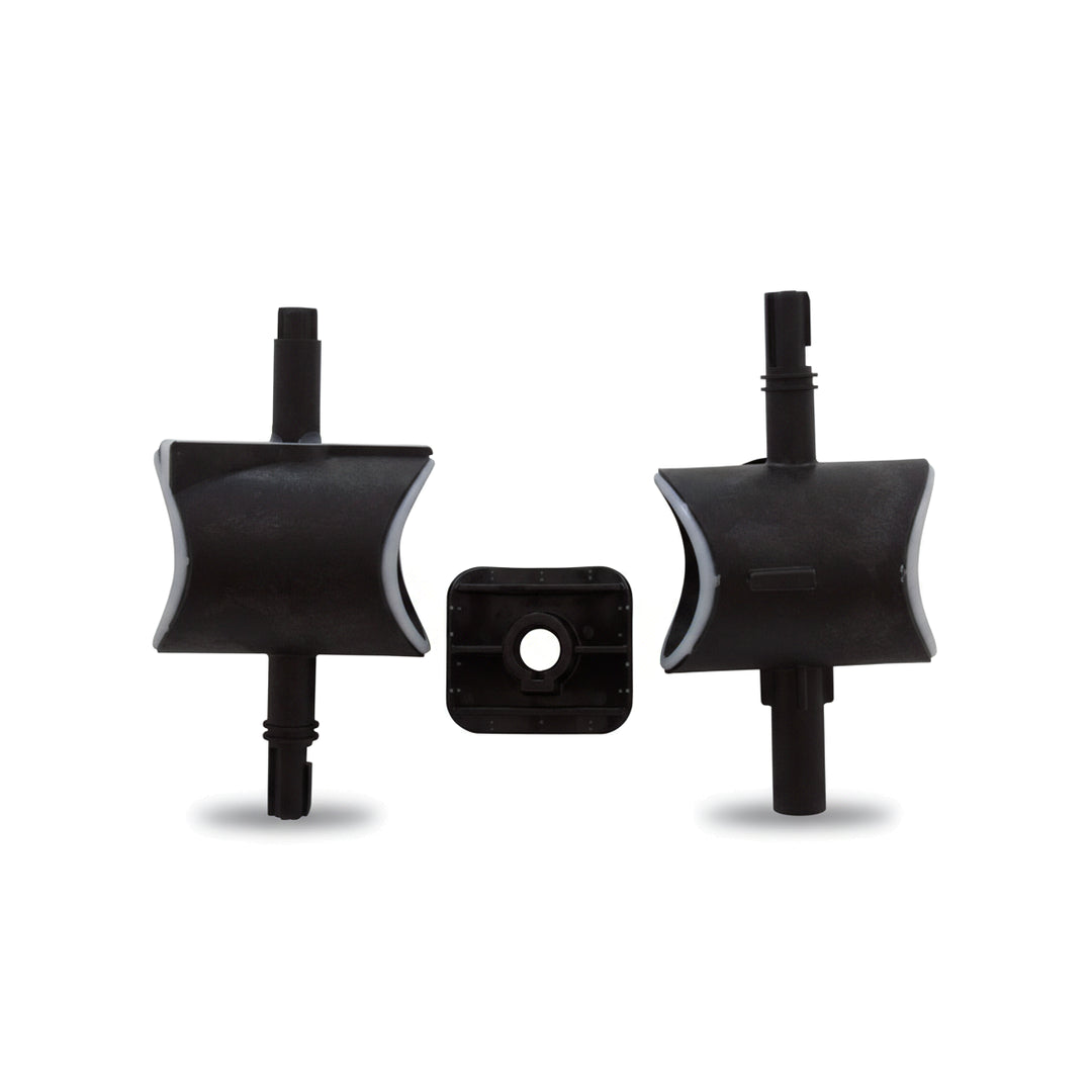 three black plastic valve parts including two curved blade-like pieces and one small square piece with circular hole