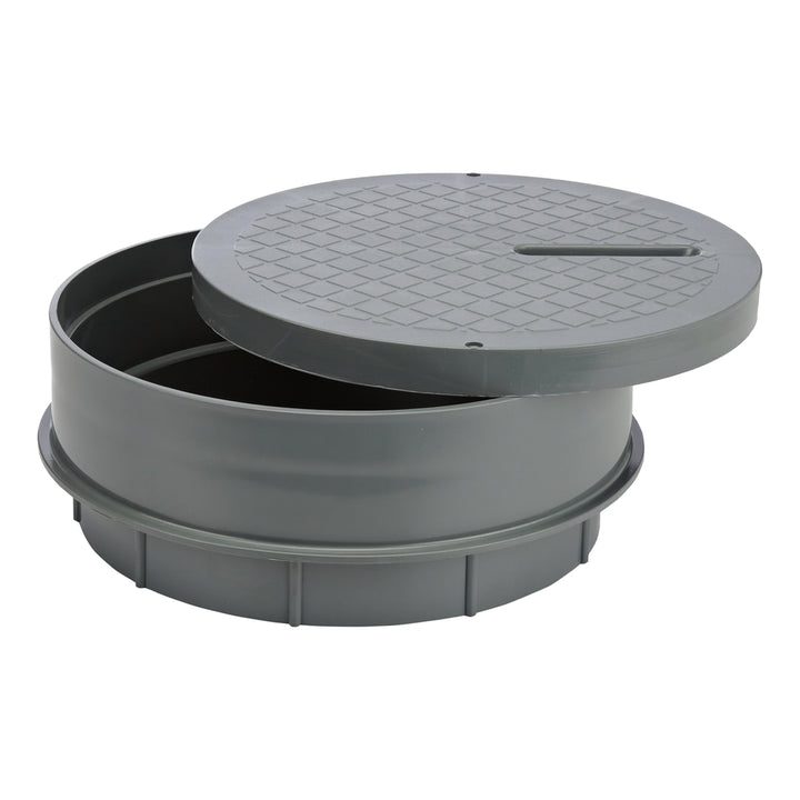 round gray plastic cover with textured top and beveled edge partially open revealing empty interior cylindrical base