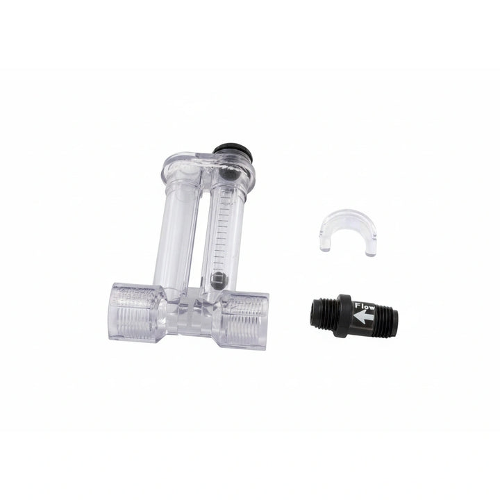 transparent plastic flow indicating device with two cylindrical chambers and a black flow direction indicator valve next to it