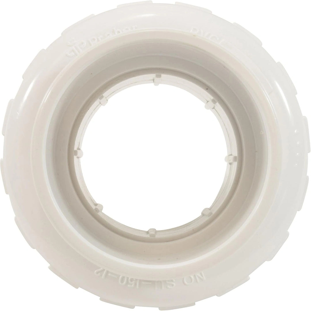 white plastic union plumbing fitting with ridged outer edge and smooth inner circular opening