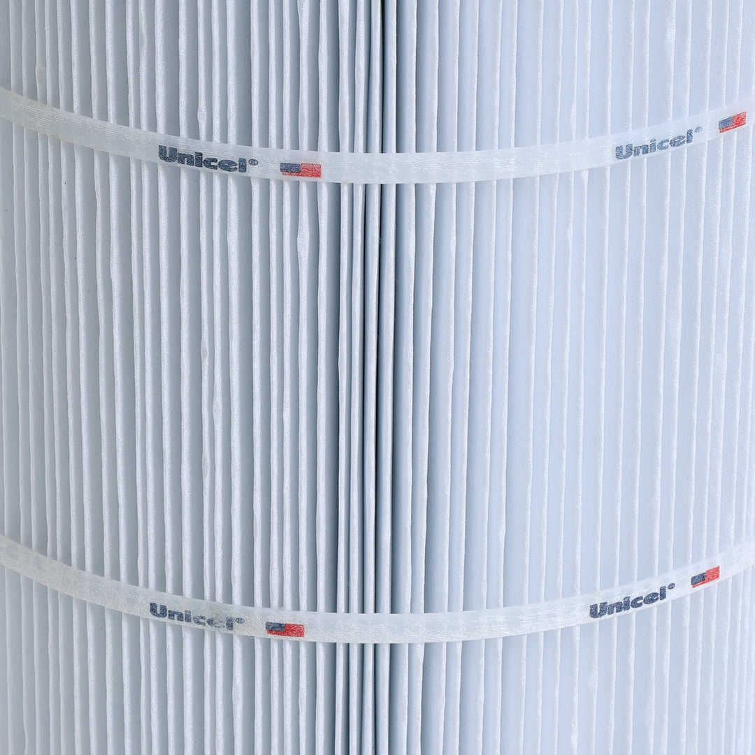 close-up of white pleated C-8474 Unicel replacement spa filter cartridge showing the pleats and branding bands with logo and flag