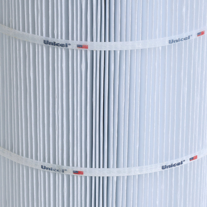 close-up of white pleated C-8474 Unicel replacement spa filter cartridge showing the pleats and branding bands with logo and flag