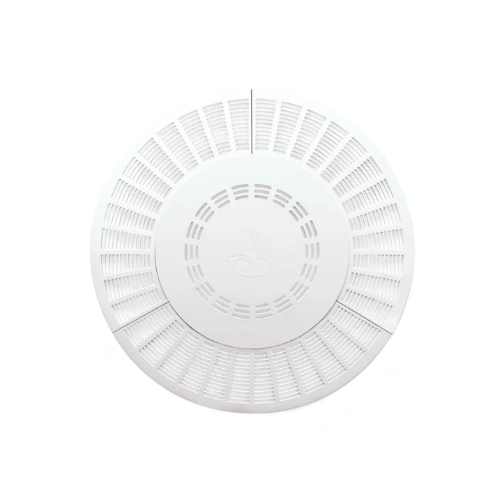 white circular pool drain outlet cover with multiple evenly spaced ventilation slots and a central circular section