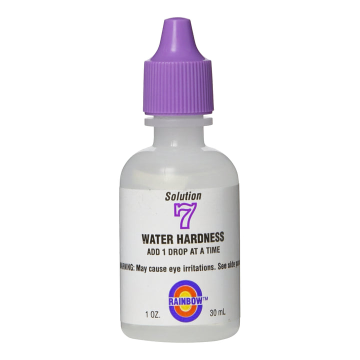 small clear plastic dropper bottle with a purple cap labeled solution 7 water hardness additive 1 ounce and rainbow logo