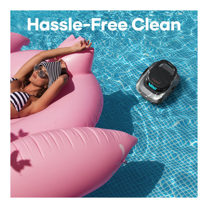 Aiper Scuba SE cordless robotic pool cleaner submerged near a pink inflatable float with a sunbathing woman.