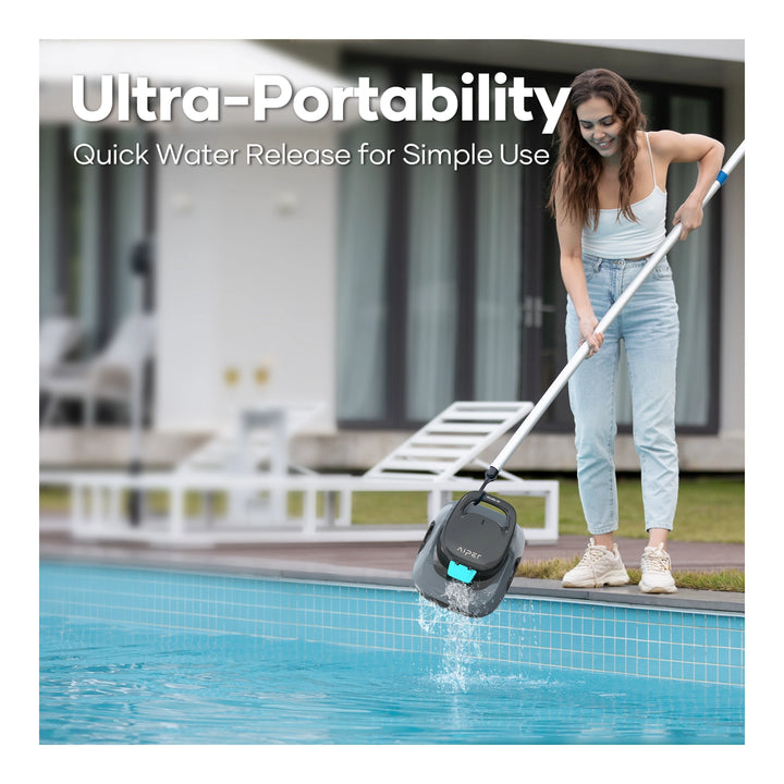 Woman uses a telescopic pole to lift the gray Aiper Scuba SE robotic pool cleaner from a pool, draining water.
