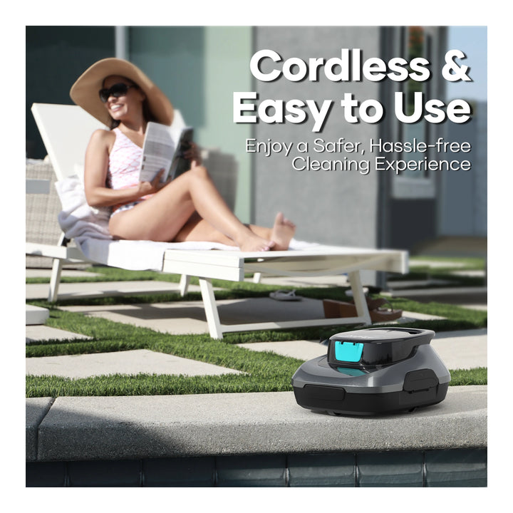 Aiper Scuba SE cordless robotic pool cleaner on pool edge, woman reading on lounge chair in background