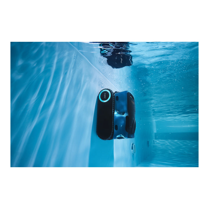 Aiper Scuba X1 Pro Max cordless robotic pool cleaner climbing underwater pool wall, black with blue accent ring.