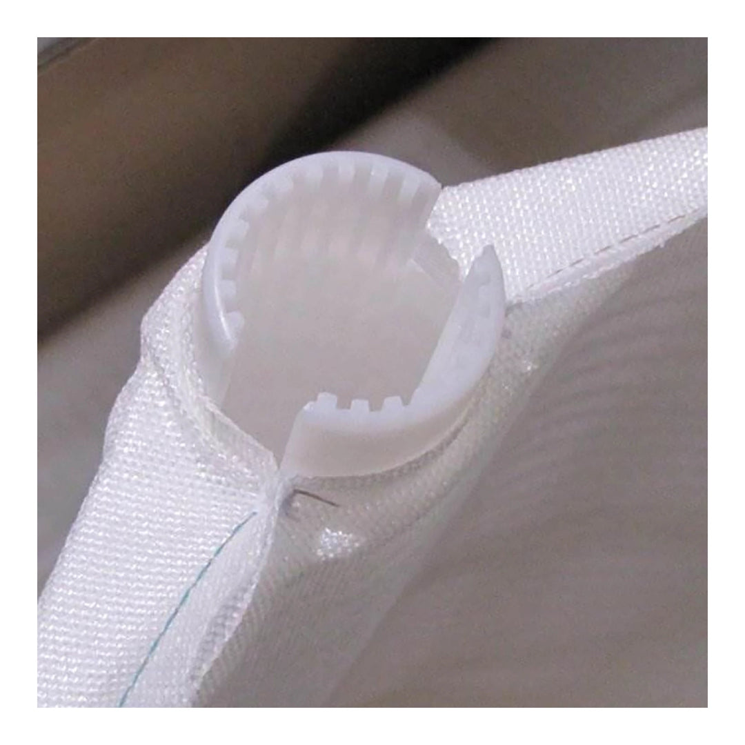 close-up of white synthetic fabric pool filter grid with plastic circular attachment featuring small teeth detail